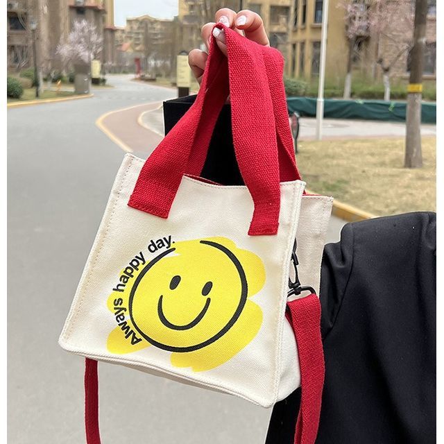 smiley face cross body bag