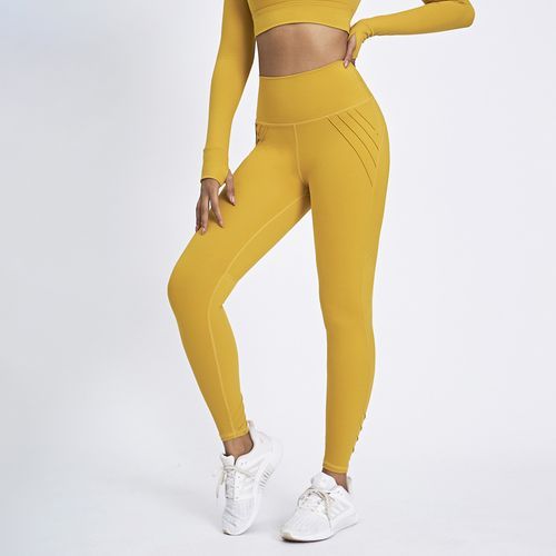 Rita Ora shows off her amazing figure in yellow sports bra and leggings  while heading to