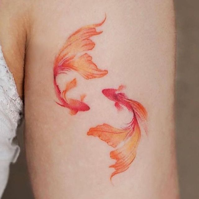 The meaning of a goldfish tattoo drawing history photo examples  sketches facts