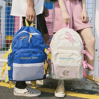 Backpack with mesh discount pocket