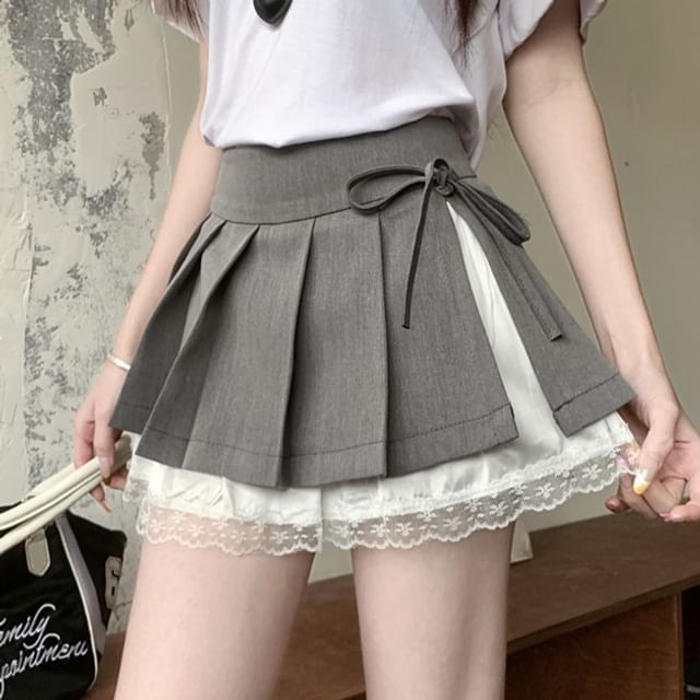 Joyciful-Mini-jupe trapèze plissée taille haute avec empiècement en dentelle et nœud