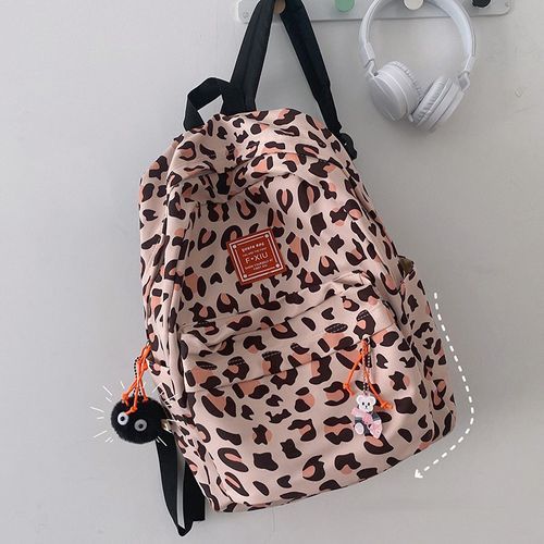 Animal Print Crossbody Backpack With Zipper Detailing - Metal Button  Closure Fold Over Front Tab - Two Zipper & One Open Pocket Under Front Tab  - One Large Back Zipper Pocket -