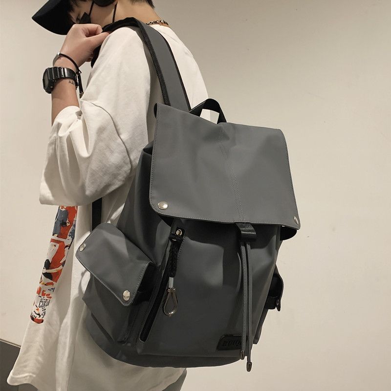 backpack with drawstring and flap