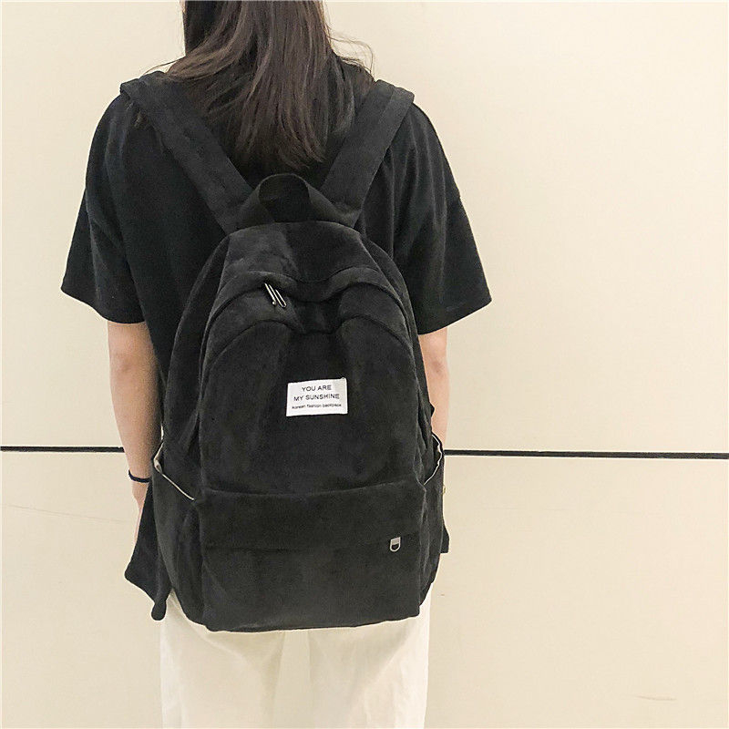 black corduroy backpack