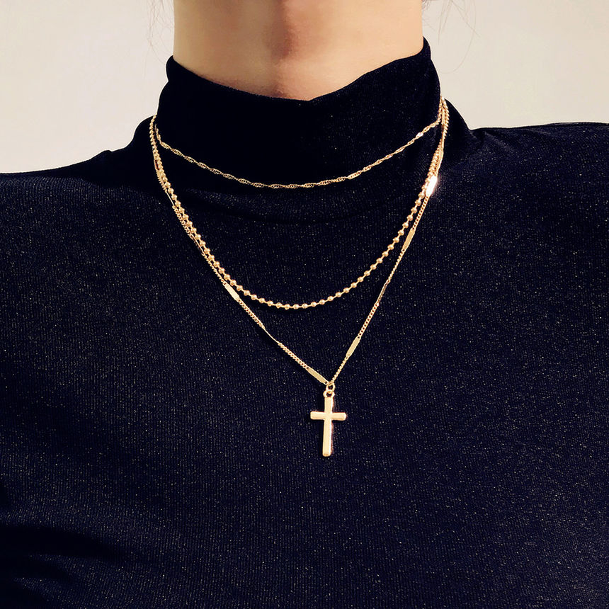 cross necklace layered