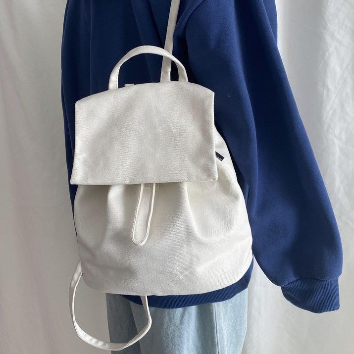 backpack with drawstring and flap