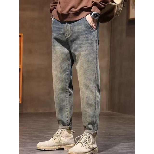 Acrius-Mid Rise Washed Tapered Jeans