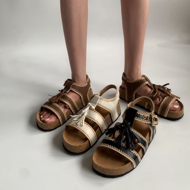 Queen Zoo-Tasseled Roman Sandals