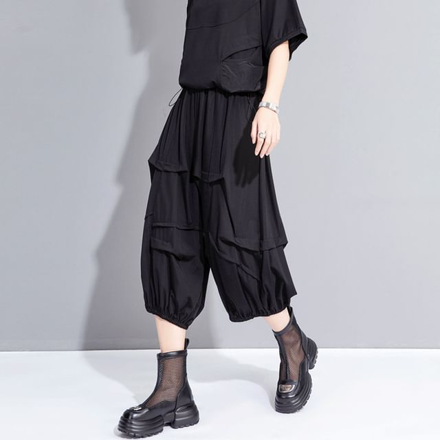 SIMPLE BLACK-Mid Rise Plain Asymmetrical Capri Harem Pants